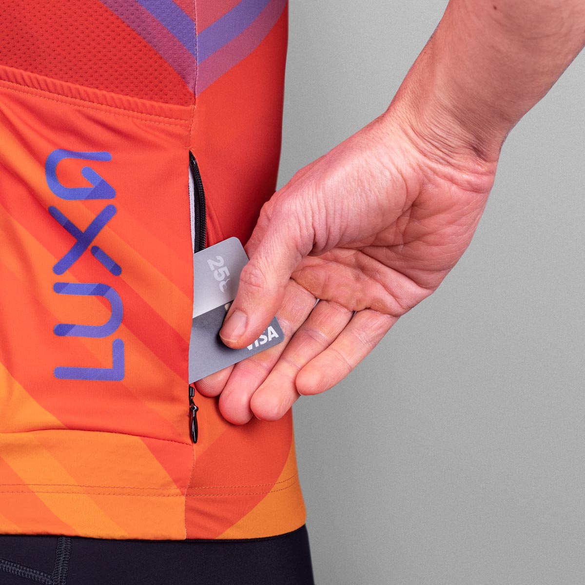 This cycling jersey features a dynamic design in shades of orange and blue, perfect for riders who want to stand out on the road.
